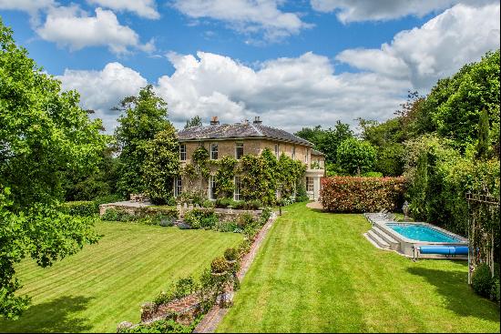 An elegant, late-Georgian river fronted manor situated in about 4.5 acres with uninterrupt