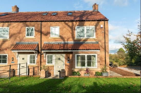 A spacious four bedroom end-terraced townhouse built by Brierley Homes, located in the pop