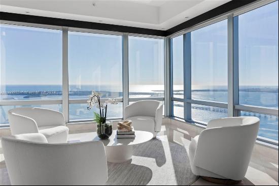 Elevate your lifestyle in this magnificent corner residence with panoramic views from Key 