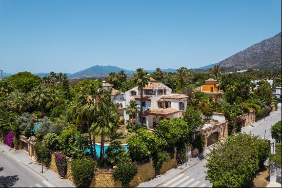 A spacious villa with a large garden and swimming pool within Marbella's Golden Mile.