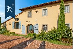 Elegant villa with outbuilding, garden and olive grove for sale on the hills between Pisa 