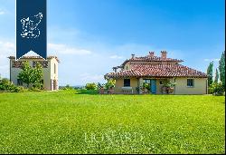 Elegant villa with outbuilding, garden and olive grove for sale on the hills between Pisa 