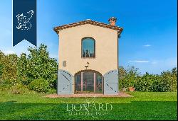 Elegant villa with outbuilding, garden and olive grove for sale on the hills between Pisa 