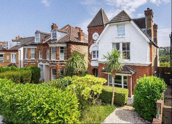 A unique detached five bedroom family home with a beautiful sunny south-east facing garden