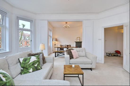 An outstanding three bedroom apartment set on the second floor of a highly sought-after pe