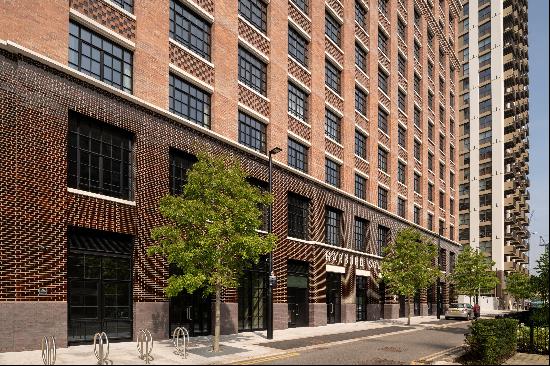 A unique  sixth-floor, loft apartment in a warehouse-style building with exposed concrete 