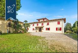 Charming farmstead with agritourism resort for sale on the Tuscan hills