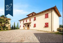 Charming farmstead with agritourism resort for sale on the Tuscan hills