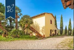 Charming farmstead with agritourism resort for sale on the Tuscan hills