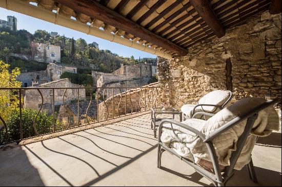 A unique village house with terraces for sale in Oppede-le-Vieux.