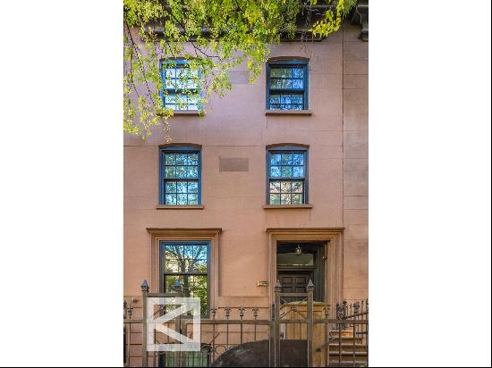 Built in the late 1880s, this exceptional townhouse is located on a picturesque, tree-l