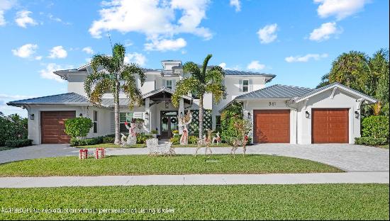 Spectacular golf course front home in the sought-after community of North Palm Beach. The 