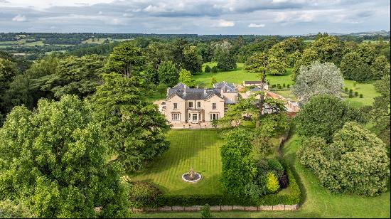 A magnificent unlisted country house set in about 27 acres of attractive gardens and parkl