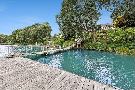 This stunning, fully renovated waterfront home features 4 bedrooms and 5 baths, with year-