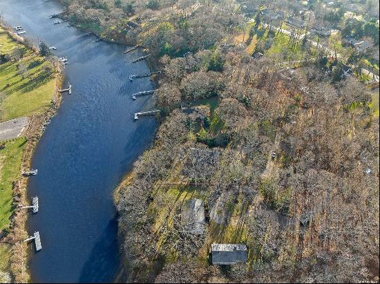 A must see secluded water front Compound. Rarely do you find two houses on a one acre lot.