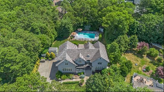 **Elegant Masterpiece in the Heart of Smithtown Pines** Welcome to this exquisite, custom-