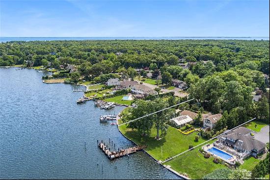 Picturesque location nestled on the Connetquot River with 181 feet of bulkheaded waterfron