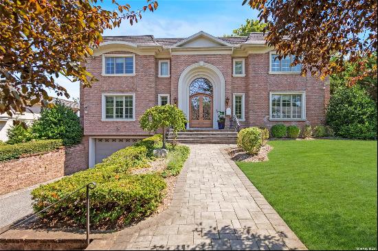 Welcome to this picture-perfect 7-bedroom, 6.5-bathroom brick center hall colonial, offeri