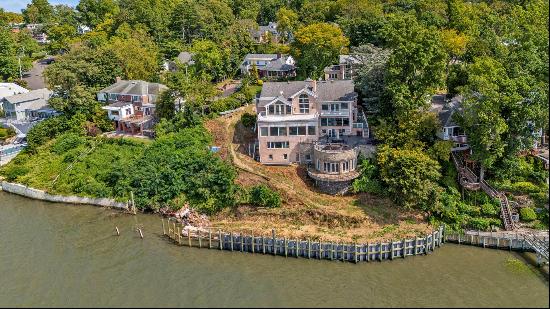 Welcome to an exquisite waterfront estate on Long Island's prestigious Gold Coast, nestled