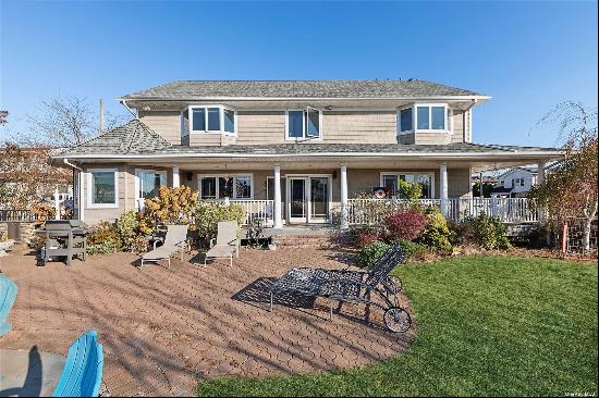 Stunning Waterfront Colonial sits on a quiet Cul de Sac with spectacular views of the bay.