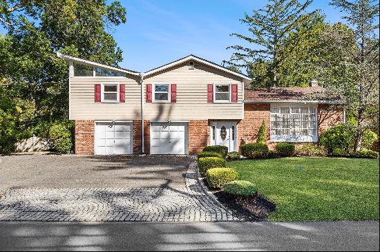 This Beautifully Renovated 4 Bedroom,3 Bathroom Home on an Oversized Property with Lush Gr