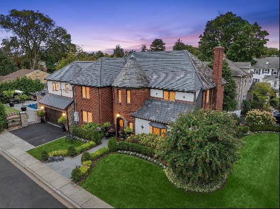 Discover luxury living and impeccable style in this meticulously renovated Tudor home loca