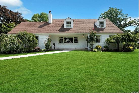 Welcome to this sunny brick expanded ranch in the prestigious Village of Oyster Bay. This 