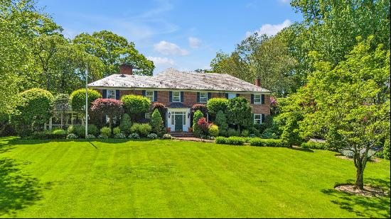 Nestled on one of Manhasset's most prestigious streets in the village of Flower Hill, 65 E