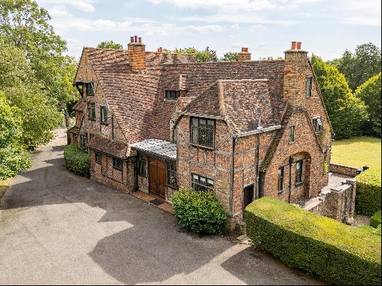 Located in the prestigious Coombe Hill private estate, this unique well maintained detache