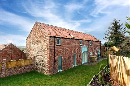 An impressive five bedroom, three-bathroom barn conversion located within a highly sought-