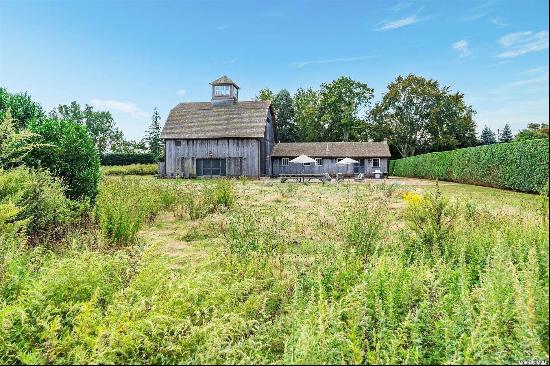 Iconic 1800s Barn with Modern Flair! This mid-1800s barn offers a rare opportunity to own 