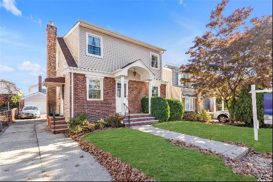 MOTIVATED SELLER!! Beautiful one-family home with a two-family layout, nestled in Bayside,