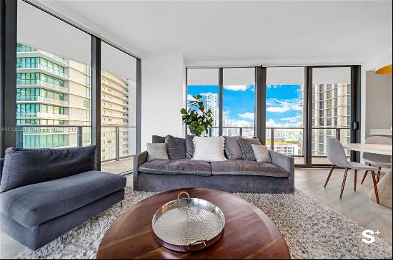 Experience Miami's ultimate luxury with this upscale 1-bedroom plus den condo in Edgewater