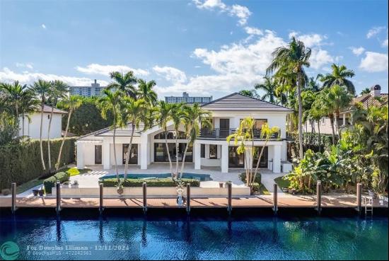 Lavishly remodeled waterfront estate in the prestigious and privately patrolled Seven Isle