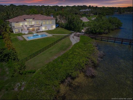 This private, gated 'Legacy Estate' is nestled on an expansive 1.25 acres, boasting over 1