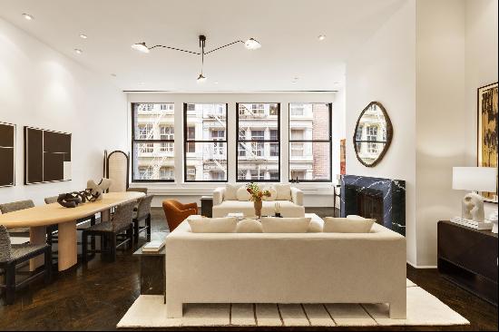 Situated in the heart of Soho, this 3-bedroom, 3.5-bathroom loft in a boutique full-ser