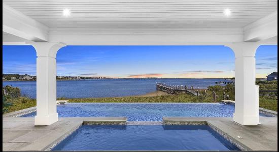 Architectural masterpiece situated on 175' of private sandy beachfront on the south side o