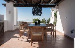 Bright beachfront duplex penthouse in a luxury residential complex in Estepona