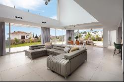 Modern villa with stunning green surroundings and seaviews in Mijas area