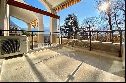 Lugano: elegant duplex-penthouse for sale with partial Lake Lugano view