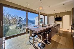 Modern villa for sale in Ruvigliana with large panoramic terrace overlooking Lake Lugano