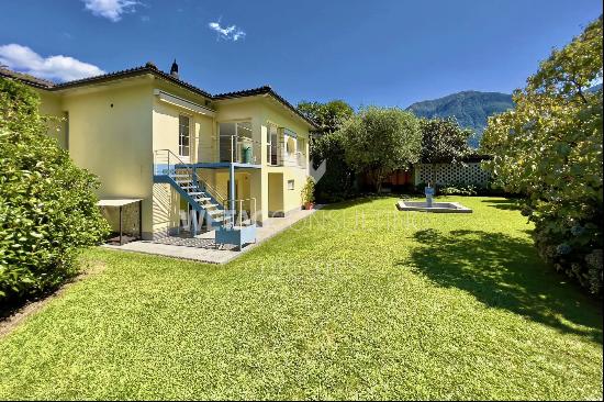 Modern style villa surrounded by greenery in Ascona for sale