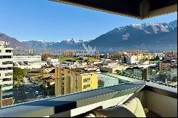 Modern penthouse apartment with lake view for sale in a central location in Locarno