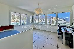 Modern penthouse apartment with lake view for sale in a central location in Locarno