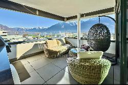 Modern penthouse apartment with lake view for sale in a central location in Locarno