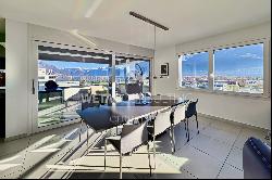 Modern penthouse apartment with lake view for sale in a central location in Locarno