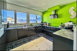 Modern penthouse apartment with lake view for sale in a central location in Locarno