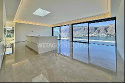 Lugano-Bissone: exclusive penthouse apartment for sale with stunning views over Lake Luga