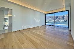 Lugano-Bissone: exclusive penthouse apartment for sale with stunning views over Lake Luga