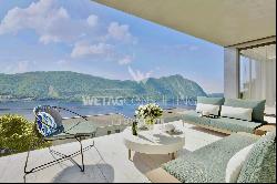 For sale in Lugano-Bissone elegant apartment with terrace & magic lake view